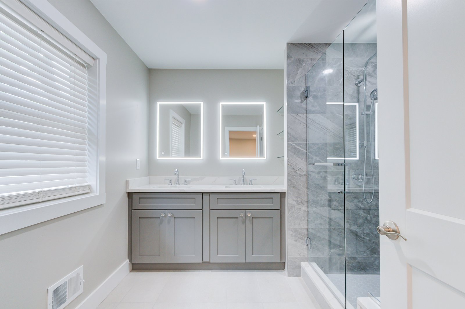 Hazelhurst + Remodel primary bathroom vanity and large shower by Reschka Design Build
