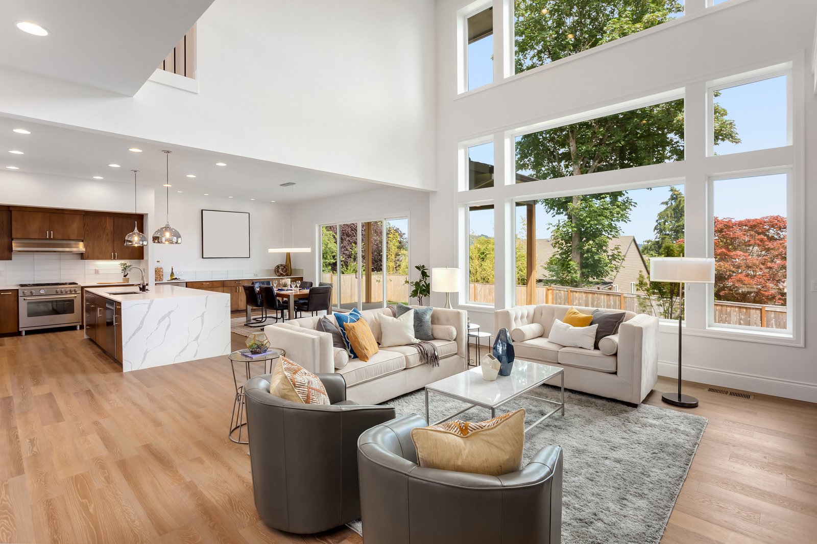 Oakwood + Haven living room with large windows by Reschka Design Build