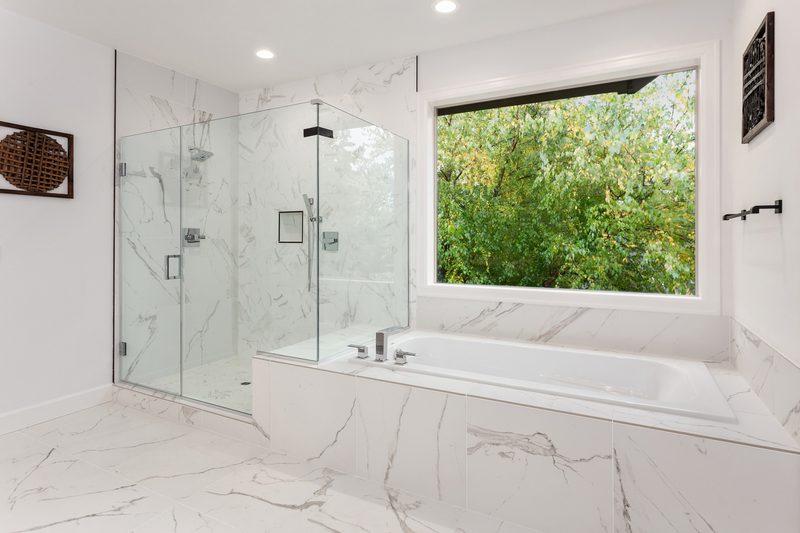 Sterling + Modern walk-in shower by Reschka Design Build