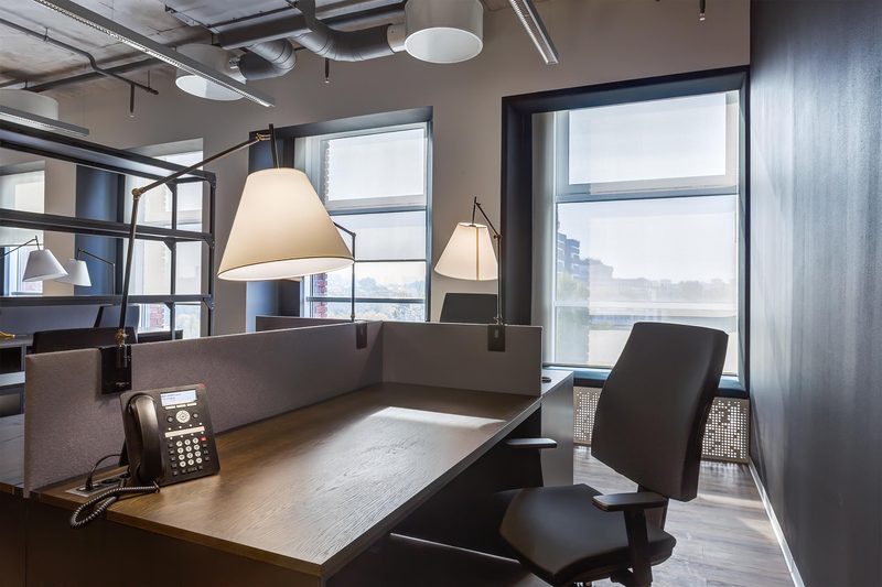 Urban + Workspace corner desk window view by Reschka Design Build